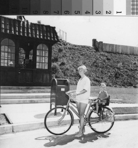 [Dyan Geib and her daughter on a bicycle at the first Mission Viejo post office photograph]
