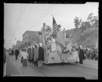 Knights of Columbus accompanying float carrying Blessed Sacrament in Catholic parade marking victory over Nazis, Los Angeles, Calif., 1945