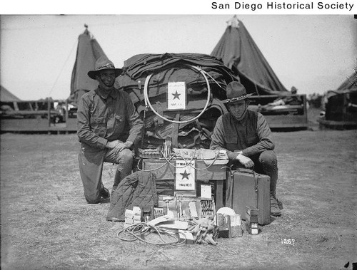 Two soldiers with supplies donated by the American Humane Association's American Red Star Animal Relief
