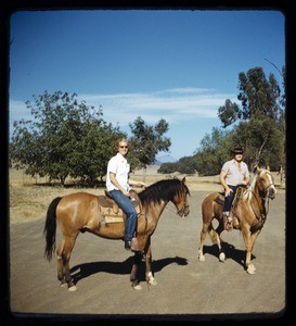 Man & woman on horseback, Milner ranch, Ojai, Calif., ca. 1950s