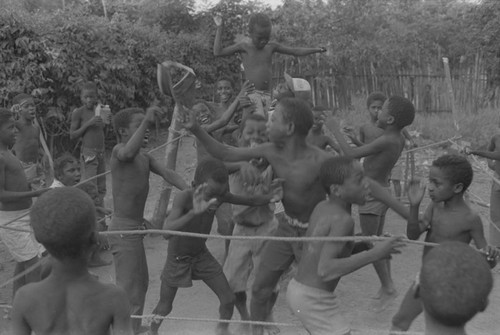 Children cheering inside boxing ring, San Basilio de Palenque, ca. 1978