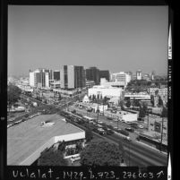 Cityscape of Beverly Hills looking east along Wilshire Blvd. at Santa Monica Blvd, Calif., 1973