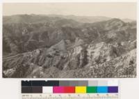 San Fernando picture #3. Vicinity of the Newhall tunnel. Knife like ridges with vertical eroded sides are characteristic of this region. Chamise and sage are the common types