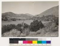 From same point as No. 255350 looking northwest toward Alamo Creek Bridge. Sage type. Open woodland type of Quercus lobata, agrifolia, douglasii. Sage type on right consists of Salvia leucophylla and Artemisia californica; that on left of Salvia mellifera