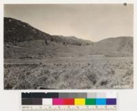 Looking west. Shows pinon and sagebrush types, meadow and burn. Note homestead. Tulare County