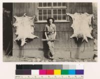 Big Sur Ranger station. Guard Forbes with wild goat hides. Monterey County