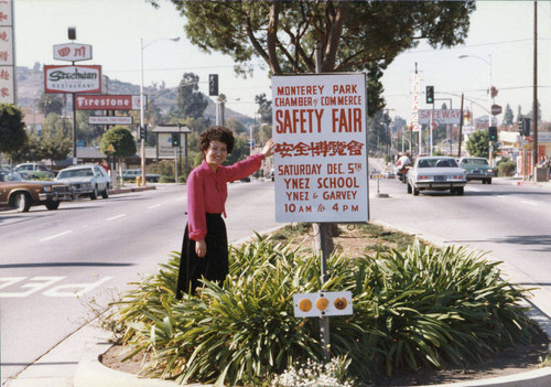 Photograph of Lily Chen and a Safety Fair sign