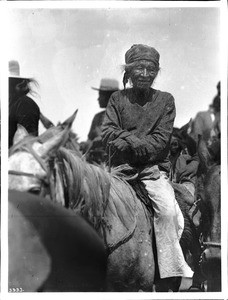 Old Navajo Indian man sitting on a horse, ca.1900
