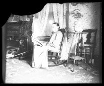 Woman in rocking chair in parlor