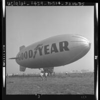 Ground crew tethering the Goodyear blimp, Columbia at Orange County Airport, Calif., 1963