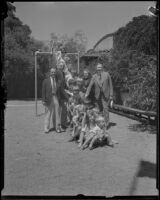 John C. Porter, mayor of Los Angles, with children on a slide, Los Angeles, 1929-1933