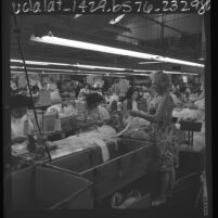 Rose Holmes supervising garment workers at Guild Lingerie in Los Angeles, Calif., 1966