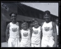 Junior Olympic athletes Johnny Falcon, Jerry Deal, Rex Heap and Mike Pina in "Los Angeles 1932" uniforms, Los Angeles, 1929