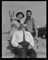 Alice Driscoll pours Charles Hollar a drink while Al Mauch watches, Maywood, 1935