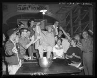 University of Southern California freshman Thayer Holbrook cools feet in ice water after playing table tennis for 50 hours in 1959