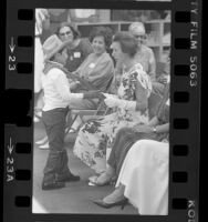 Great Britain's Princess Anne accepting painting from boy at child care center in Los Angeles, Calif., 1984