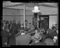 Actor Jimmy Stewart induction in United States Army; Stewart being fingered printed, 1941