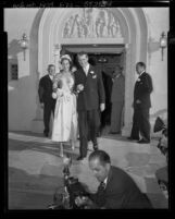 Actor Jimmy Stewart and Gloria H. McLean walking out of Brentwood Presbyterian Church after their wedding ceremony, Los Angeles, 1949