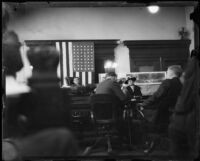 Mrs. Elizabeth Besenty on the witness stand during the Arthur Burch murder trial, Los Angeles, 1921