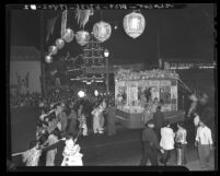 Parade float and marchers in Autumn Moon Festival in Los Angeles' Chinatown, 1941