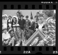 Actors Jodie Foster and Johnny Whitaker presenting painting to Mark Twain Junior High school students in Venice, Calif., 1973