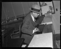 Leon Bone collecting fingerprints after bank robbery, Los Angeles, 1936