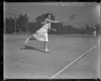 Catherine Rose, Tennis Champion on the Griffith Park tennis team, playing on a court, 1933