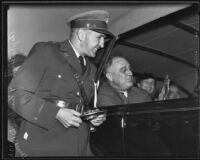 President Roosevelt at the C. C. C. camp holding a model of the "Spirit of the C. C. C." statue presented by Capt. Lyston S. Black, Los Angeles, 1935