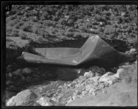 Section of blast-damaged conduit along the Los Angeles Aqueduct stretches across a stream in No-Name Canyon, Inyo County vicinity, [about 1927]