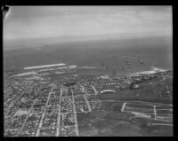 Aerial view of towards harbor with ships from the Navy's Pacific Fleet in the background, San Pedro