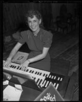 Pat Hanley playing electric organ, Los Angeles, 1938