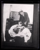 Police Detective examines the contents of a trunk used by Winnie Ruth Judd to ship a corpse, Los Angeles, 1931