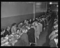 Men enjoy Thanksgiving dinner at the Midnight Mission, Los Angeles, 1935