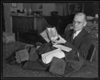 Detective Lieutenant Elmer Larson with stolen purses, Los Angeles, 1935