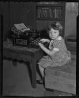 Camille Moffett seated at a typewriter, Los Angeles, 1936