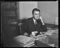 U.S. Attorney Peirson M. Hall at his desk on the phone, Los Angeles, 1933-1937