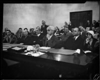 Arraignment of Superior Judge Walter S. Gates on bribery acceptance charges, in court with defense attorneys and his wife, Los Angeles, 1932