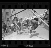 Fidelia Marquez with children playing at Council of Mexican-American Affairs Head Start Center in Los Angeles, Calif., 1967