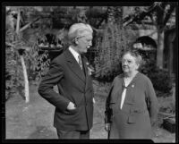 Dr. Rufus B. Von Kleinsmid, USC president, speaks with an unidentified woman