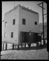 Beach house threatened by tide, Newport Beach, 1933