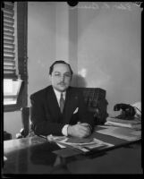 Judge Edward R. Brand seated at his desk, Los Angeles, 1930-1939