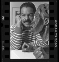 Leonard Simon with Valerie Maynard's Monzini bronze "We Are Tied to the Very Beginning," 1986