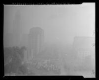 View of part of the Los Angeles Civic Center masked by smog in 1948