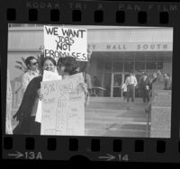 Demonstrators, outside City Hall, holding up signs, one reading "5% City Jobs in Not Enough!" at protest urging city to hire more Mexican Americans, Los Angeles, Calif., 1972