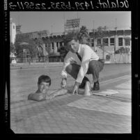 U.S. Olympic swimmer Marilyn Ramenofsky with coach Peter Daland, Calif., 1964