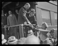 Herbert Hoover greets crowd gathered at train, Southern California, ca. 1928