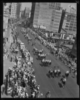 Riders and horses march in a parade for the Los Angeles birthday celebration, 1932