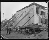 Building propped up with long poles after the earthquake, Santa Barbara, 1925