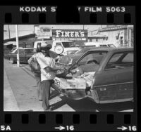 Guillermo Manzano selling produce from the back of his station wagon in Los Angeles, Calif., 1981