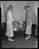 Henrietta Sumner and Beverly Dodge pack suitcase, Los Angeles, 1935